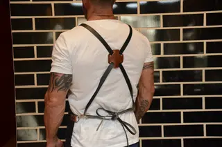 Back view showing the crossed leather straps