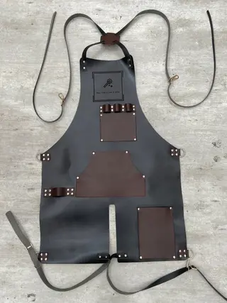Black split-leg apron with brown pockets
