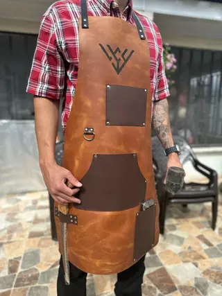 Woodworking apron worn, showing the chest pocket and D-ring