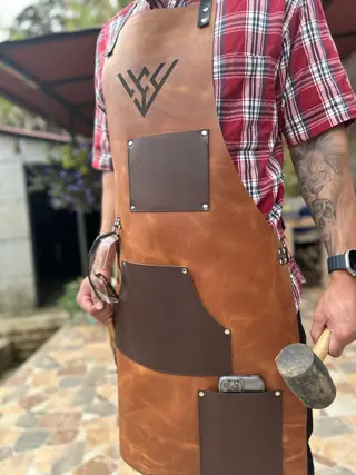 Woodworking apron worn with a hammer in the loop
