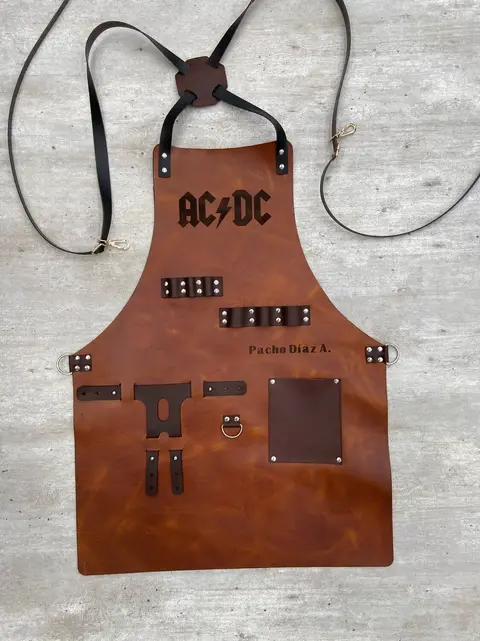 Tan leather apron engraved with a band logo